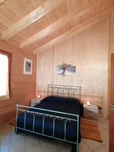 Postel nebo postele na pokoji v ubytování Agriturismo bio Apipoli