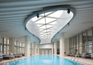 a large swimming pool with a large ceiling at Langham Place Changsha in Changsha