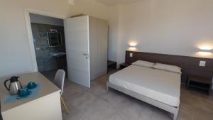 A bed or beds in a room at RESORT REIS country house
