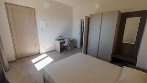 A bed or beds in a room at RESORT REIS country house
