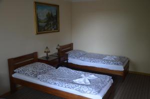 Voodi või voodid majutusasutuse Palatín toas