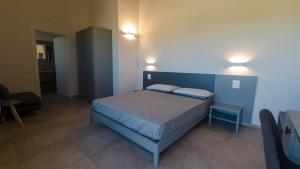A bed or beds in a room at RESORT REIS country house