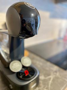 a reflection of a man in a mirror on a blender at BRUNA HOLIDAYS HOUSE in Burano