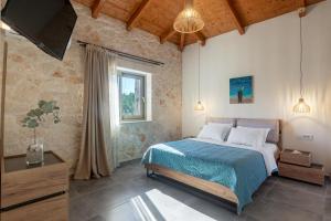 Postel nebo postele na pokoji v ubytování Tierra Olivo Villas + 37 fotografií