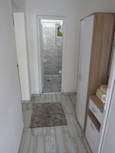 a hallway with a door leading to a bathroom at Apartments Jovanović in Perast
