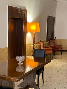 a living room with a table and a lamp at palazzo suite ducale in Venice
