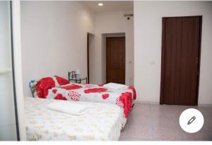 Ένα ή περισσότερα κρεβάτια σε δωμάτιο στο Camera Greta