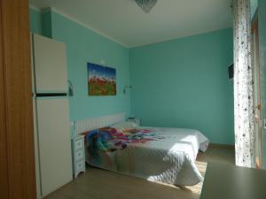 Postel nebo postele na pokoji v ubytování I Due Melograni Agriresort + 37 fotografií