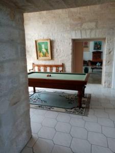 a room with a pool table in a building at La Maison Royale in Pesmes