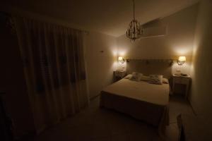 A bed or beds in a room at Villa da Luciana