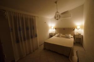 A bed or beds in a room at Villa da Luciana