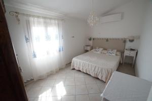 A bed or beds in a room at Villa da Luciana