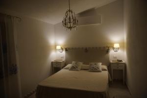 A bed or beds in a room at Villa da Luciana