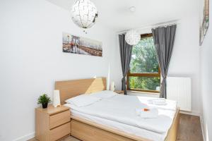 Posteľ alebo postele v izbe v ubytovaní Apartment Warsaw Business Center by Noclegi Renters