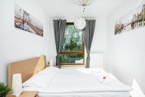Posteľ alebo postele v izbe v ubytovaní Apartment Warsaw Business Center by Noclegi Renters