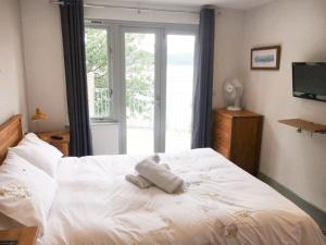 Postel nebo postele na pokoji v ubytování Abergafren Lodge