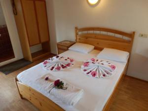 a bedroom with two beds with flowers on them at Dalyan Pension in Dalyan