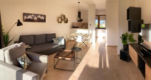 a living room with a couch and a table at Panorama Home Valča in Stará Turá