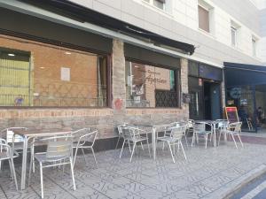 a group of tables and chairs outside of a restaurant at Agarimo in Trapagaran