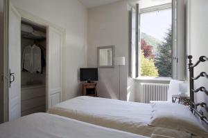 Ένα ή περισσότερα κρεβάτια σε δωμάτιο στο La Canarina Bed & Breakfast