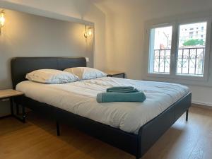 Кровать или кровати в номере Appartement Prox Lycée Arago