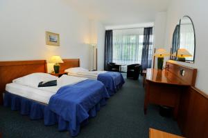 Ένα ή περισσότερα κρεβάτια σε δωμάτιο στο Hotel Magnolia