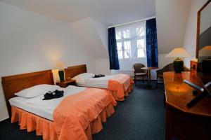 Ένα ή περισσότερα κρεβάτια σε δωμάτιο στο Hotel Magnolia