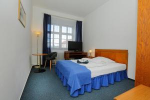 Ένα ή περισσότερα κρεβάτια σε δωμάτιο στο Hotel Magnolia
