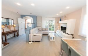 a living room with a couch and a table at HomeHolidaysRentals Royal in Pineda de Mar