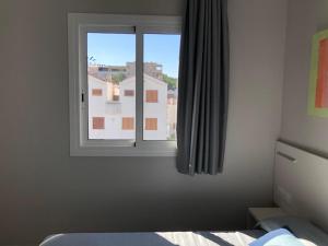Łóżko lub łóżka w pokoju w obiekcie COSTA DAURADA APARTAMENTS - Stival Park 4