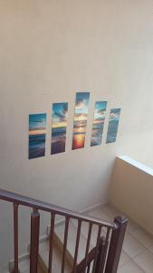 a group of pictures on a wall at House Chrysoula Mitsokopi in Sarti