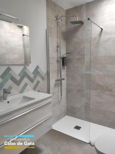 a bathroom with a shower and a sink at LA CALILLA II in San José