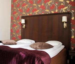 Postel nebo postele na pokoji v ubytování Best Western Vetlanda Stadshotell