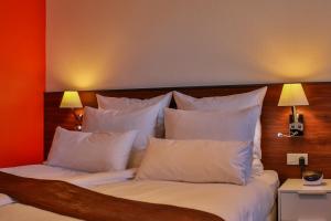 Postel nebo postele na pokoji v ubytování Hotel Saint-Hubert