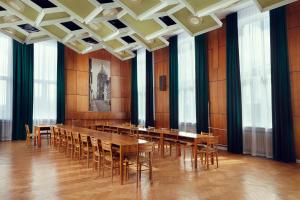 a conference room with a long table and chairs at Stary Koszalin Hostel & Hotel Services in Koszalin