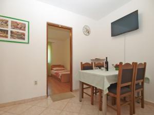 TV a/nebo společenská místnost v ubytování Apartments Klaudio 1318