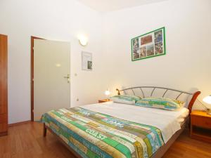 Giường trong phòng chung tại Apartments Klaudio 1318