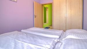Postel nebo postele na pokoji v ubytování Boromeum Residence