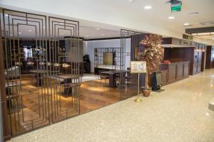 a store with tables and chairs in a room at Dila Hotel in Istanbul