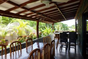 a dining room with a table and chairs at TipTop Hotel, Resto and Delishop in Panglao