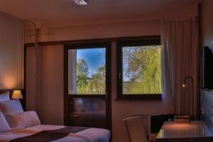 Postel nebo postele na pokoji v ubytování Hotel Saint-Hubert