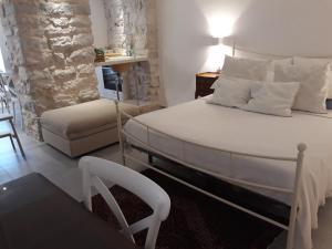 Posteľ alebo postele v izbe v ubytovaní VILLA DEI PINI TRANI