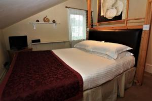 Llit o llits en una habitació de The Berkeley Guesthouse