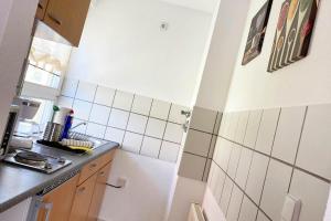 Kuchyň nebo kuchyňský kout v ubytování 1 Zimmer Apartment mit Balkon