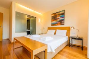 A bed or beds in a room at Alecrim Lux Tavira Residence Villa 4M