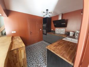 a small kitchen with a sink and a counter at Château la bastide cardan in Saint-Sulpice-de-Pommiers