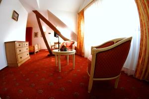 Posezení v ubytování Hotel Saint-Hubert