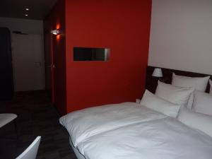 Postel nebo postele na pokoji v ubytování Hotel Saint-Hubert