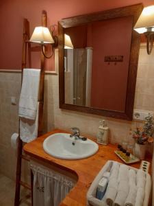 a bathroom with a sink and a mirror at Cau La Mar in Lastres +33 photos