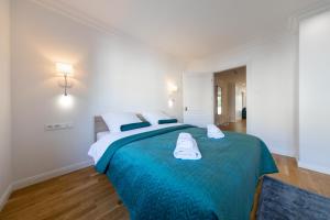 Posteľ alebo postele v izbe v ubytovaní Apartament Nowy Świat Centrum
